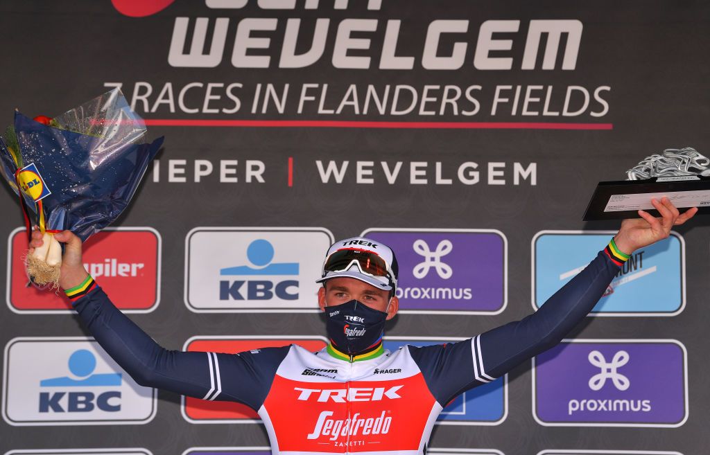 WEVELGEM BELGIUM OCTOBER 11 Podium Mads Pedersen of Denmark and Team Trek Segafredo Celebration Trophy Mask Covid safety measures during the 82nd GentWevelgem In Flanders Fields 2020 Men Elite a 2325km race from Ypres to Wevelgem GentWevelgem FlandersClassic on October 11 2020 in Wevelgem Belgium Photo by Luc ClaessenGetty Images