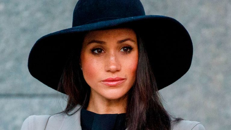 Meghan Markle, the US fiancee of Britain's Prince Harry, attends an Anzac Day dawn service at Hyde Park Corner in London on April 25, 2018.