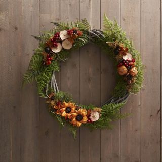 fern, dried flowers and dried fruit slices fall wreath