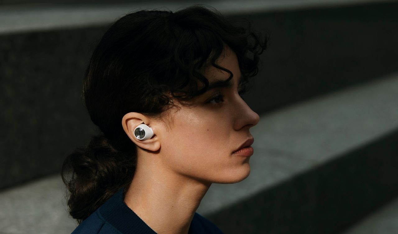 Sennheiser&#039;s Momentum True Wireless 3 earbuds being worn by a woman