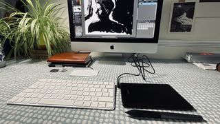 A photo of the Huion H420X connected to a Mac for a review