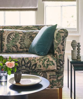 A green paisley botanical patterned sofa for a small living room.