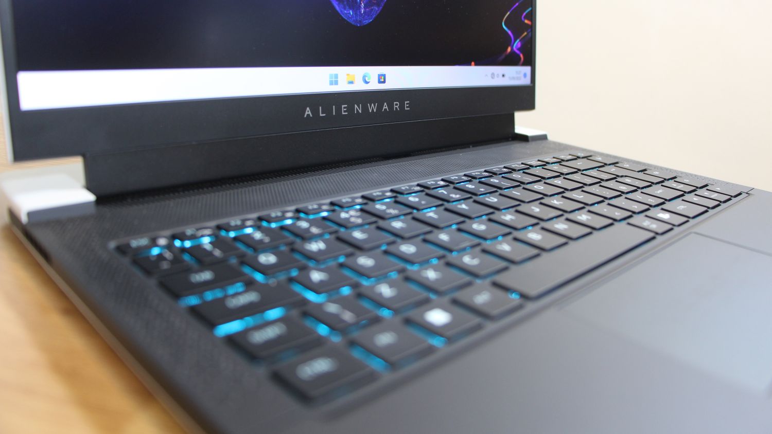Alienware x14 laptop open, close up view of brand name