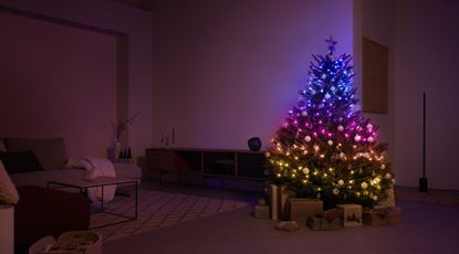 Philips Hue Festavia review her image showing string lights wrapped around a Christmas tree