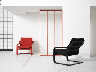 Two IKEA Pong chairs, one red and one black, in a white room