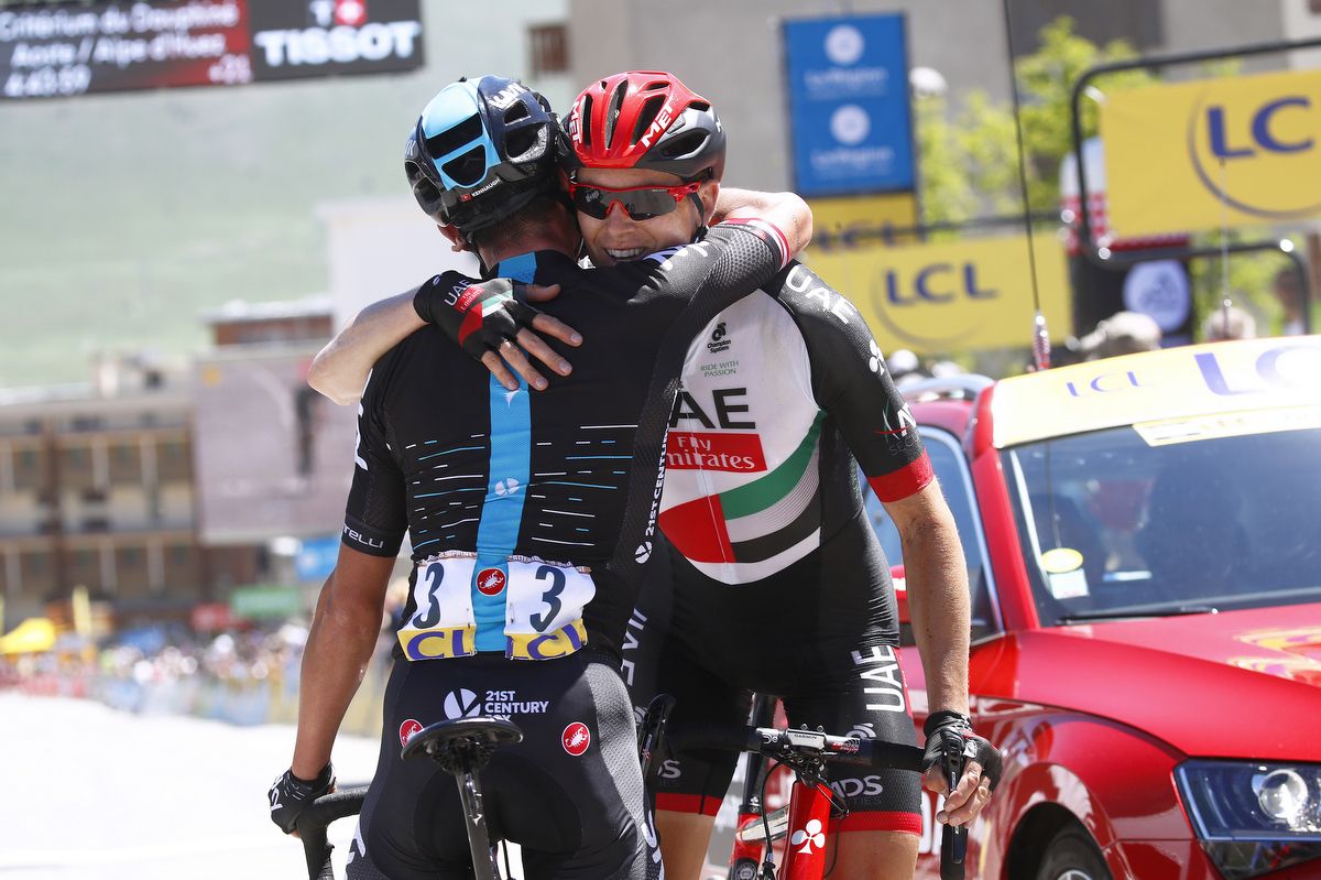 Peter Kennaugh and Ben Swift embrace after the stage
