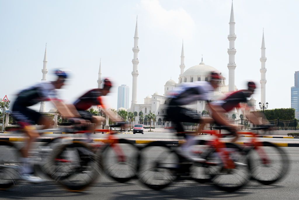 QIDFA UNITED ARAB EMIRATES FEBRUARY 20 A general view of Joshua Tarling of The United Kingdom and Team INEOS Grenadiers White best young jersey and the peloton passing in front of mosque during the 7th UAE Tour 2025 Stage 4 a 181km stage from Fujairah Qidfa Beach to Umm al Quwain UCIWWT on February 20 2025 in Fujairah Qidfa Beach United Arab Emirates Photo by Dario BelingheriGetty Images