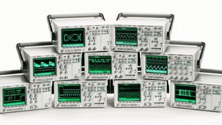 HP oscilloscopes stacked atop of one another. 
