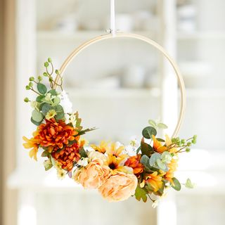 easter trends with wooden hoop and spring flowers