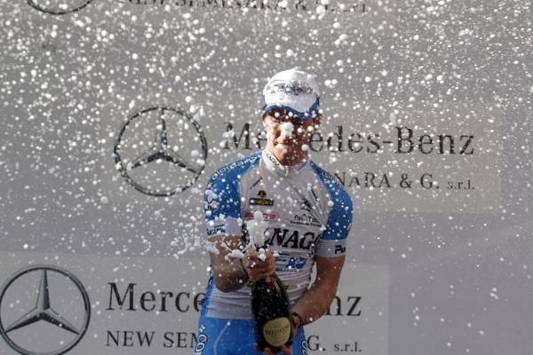 Belletti sprays the champagne after winning stage three