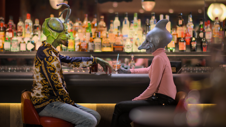 contestants sat at a bar on new netflix show sexy beasts