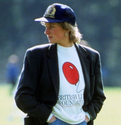 Princess Diana wearing a blazer and baseball hat 