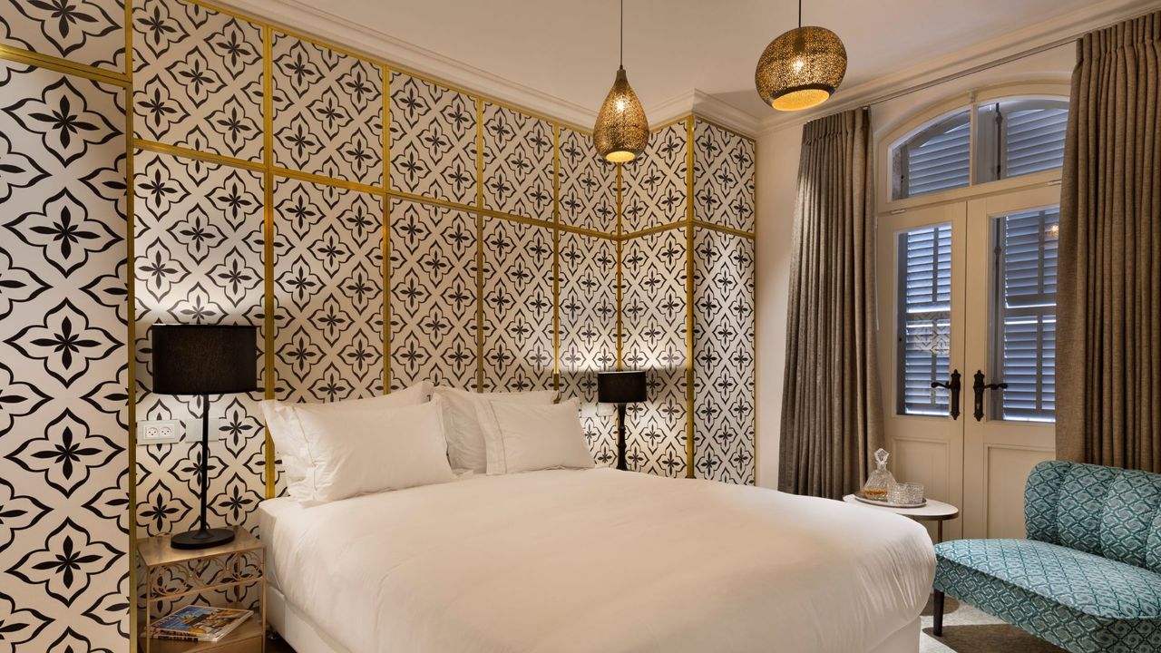 A bedroom at the drisco, one of the best hotels in israel