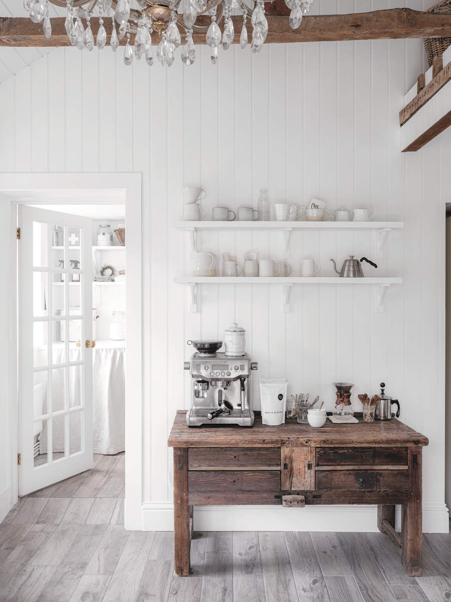 kitchen trends Rustic white kitchen with vintage sideboard and coffee machine