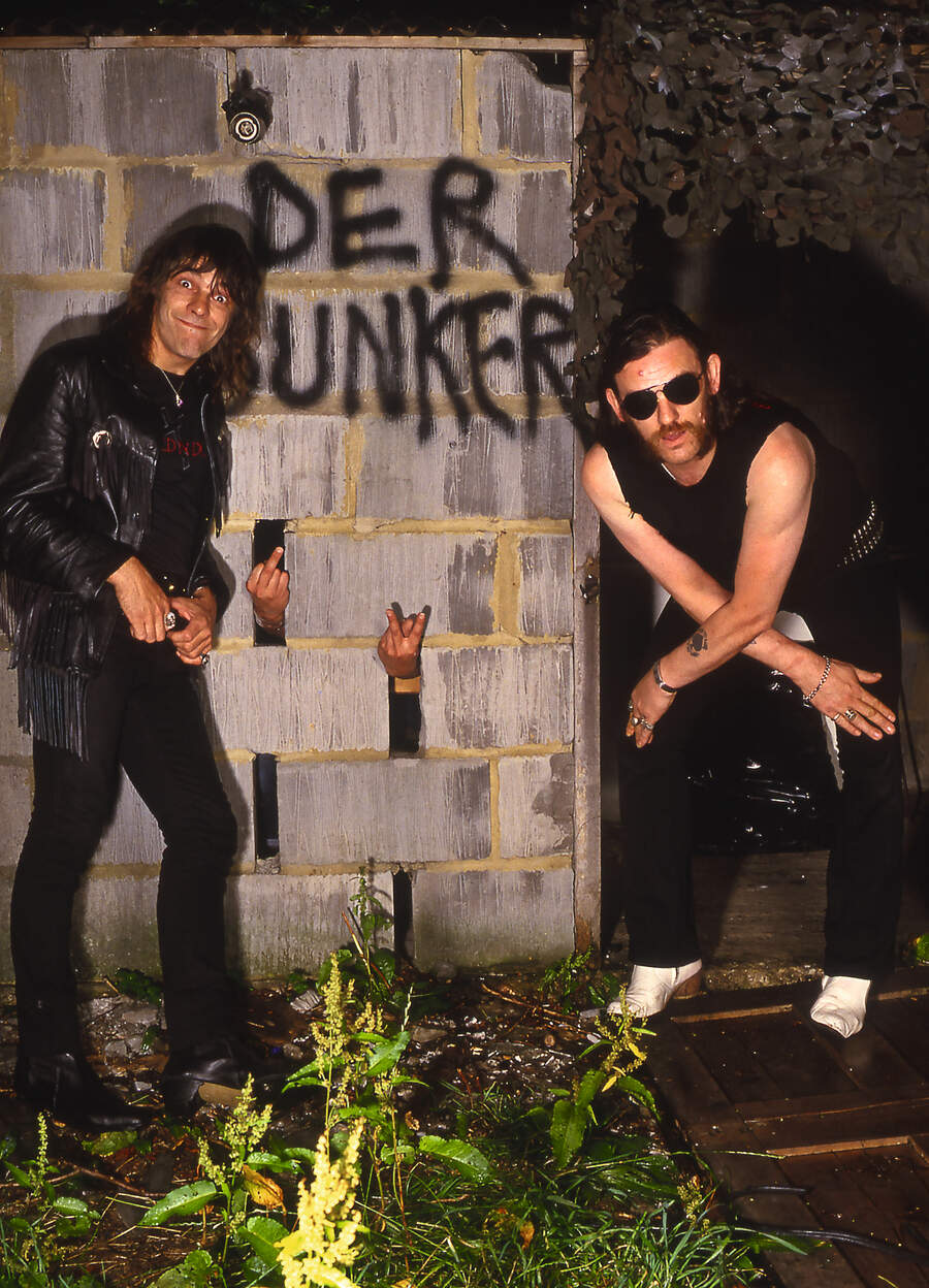 Wurzel, Phil Campbell's hands and Lemmy Kilmister in 'Der Bunker' in the back garden of Lemmy's house in Kensal Rise London UK, August 1986