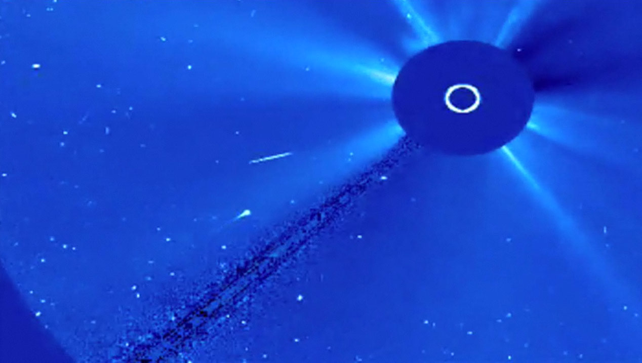 This image from a video by NASA&#039;s SOHO sun-watching spacecraft shows comet Swan (center left) as it approached the sun on March 13 and 14, 2012. The so-called sungrazer comet is not expected to survive its sun encounter.