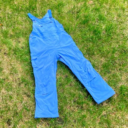 Duluth Trading Co. Heirloom Gardening bib overalls lying on lawn