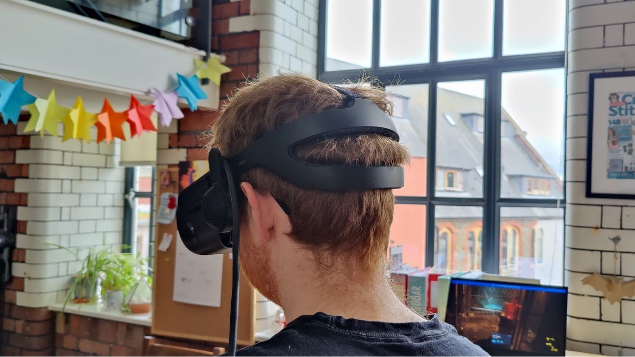 Back view of man wearing HP Reverb G2 VR Headset.