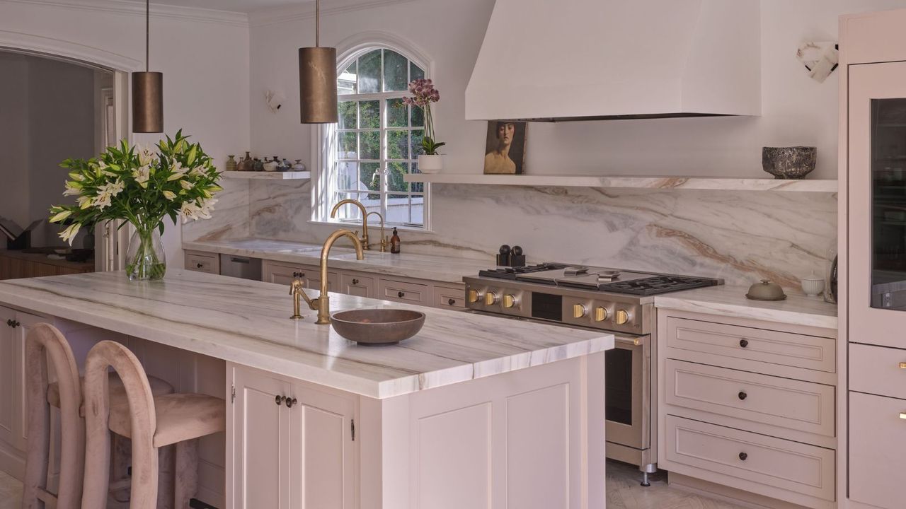 Neutral kitchen with island and marble countertops