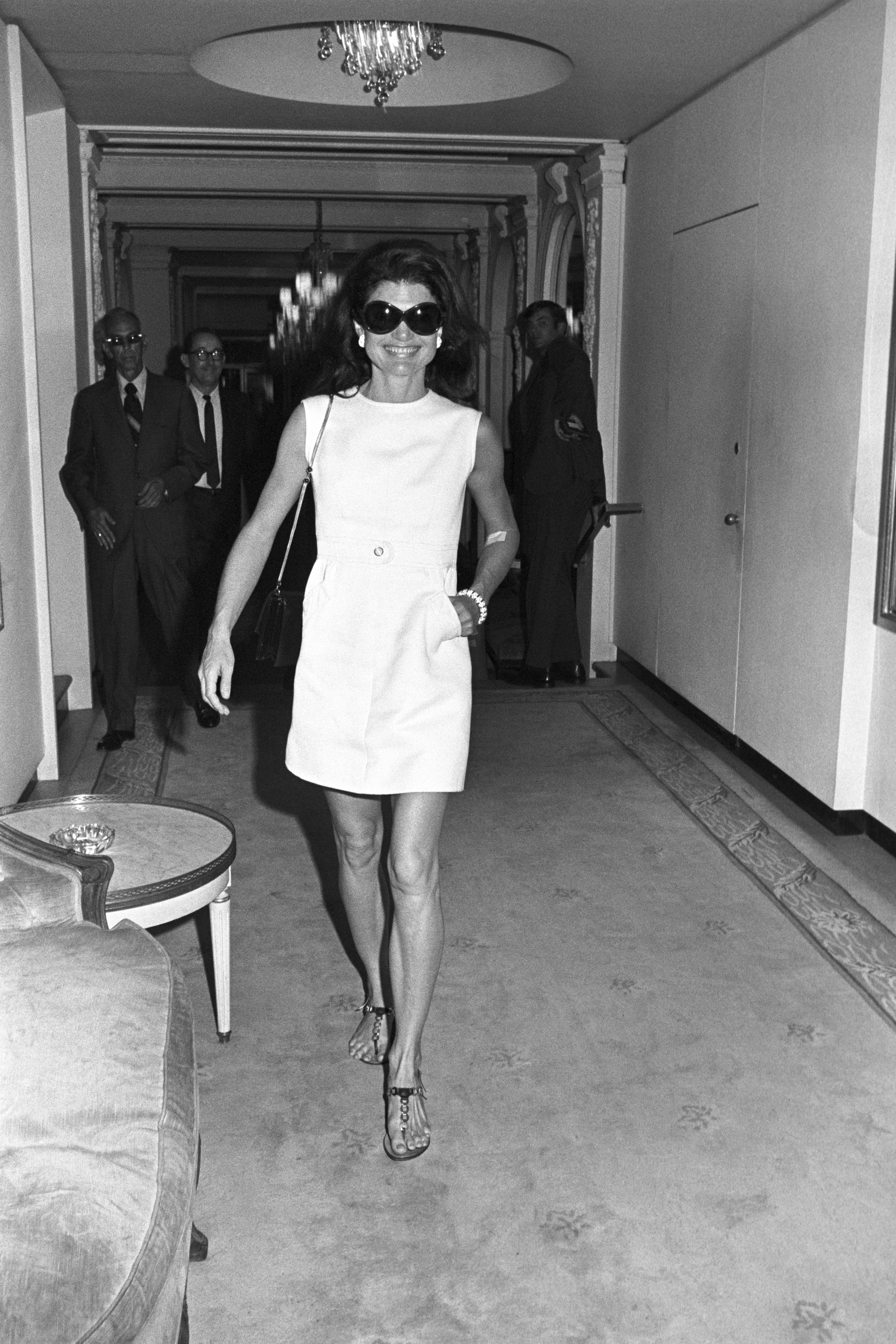 Jackie Kennedy Onassis in different late '60s
 and '70s-era summer staples.