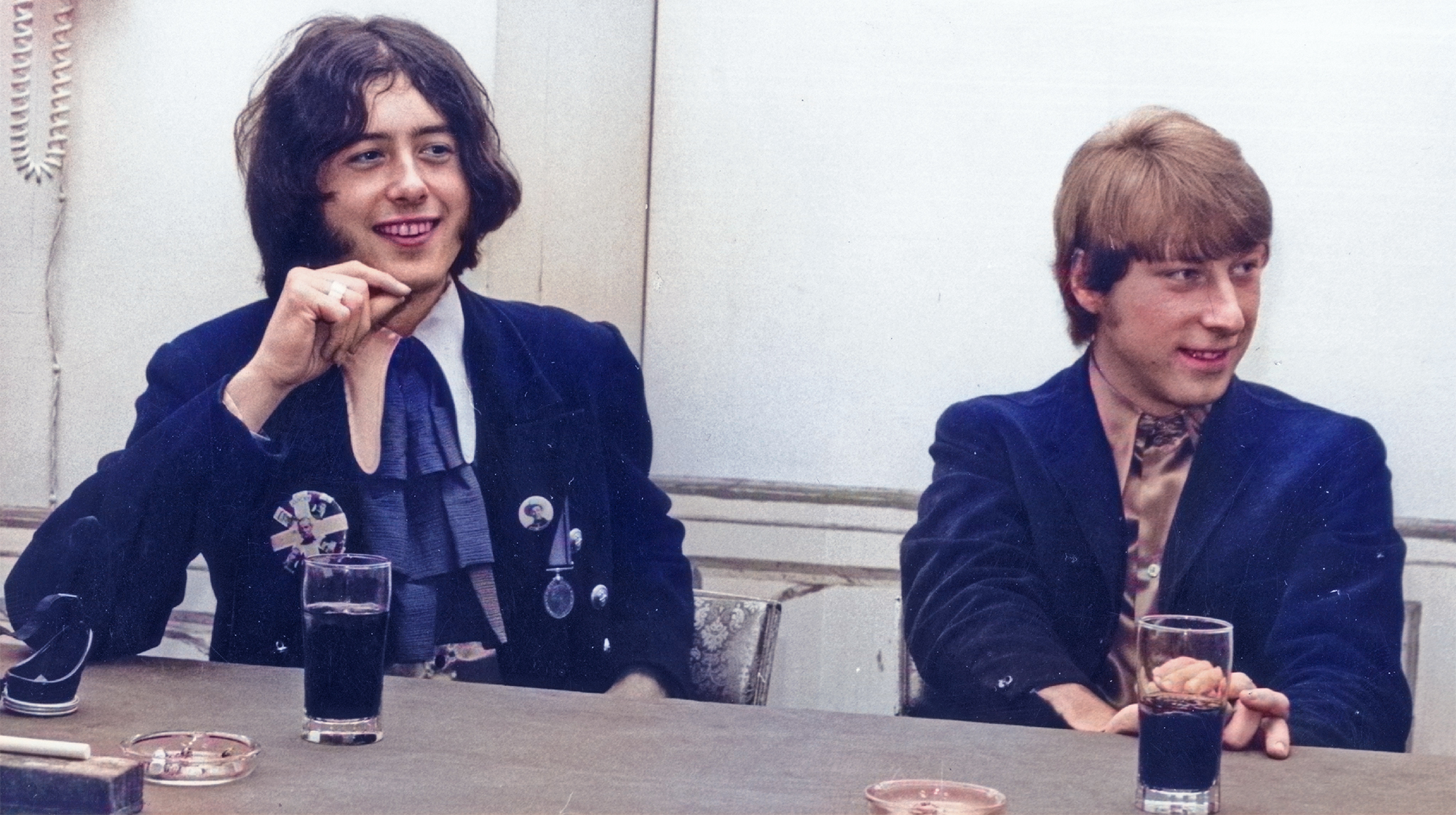 Jimmy Page and bassist Chris Dreja of the rock band &quot;The Yardbirds&quot; pose for a portrait in 1967 while sitting behind a table in England. 