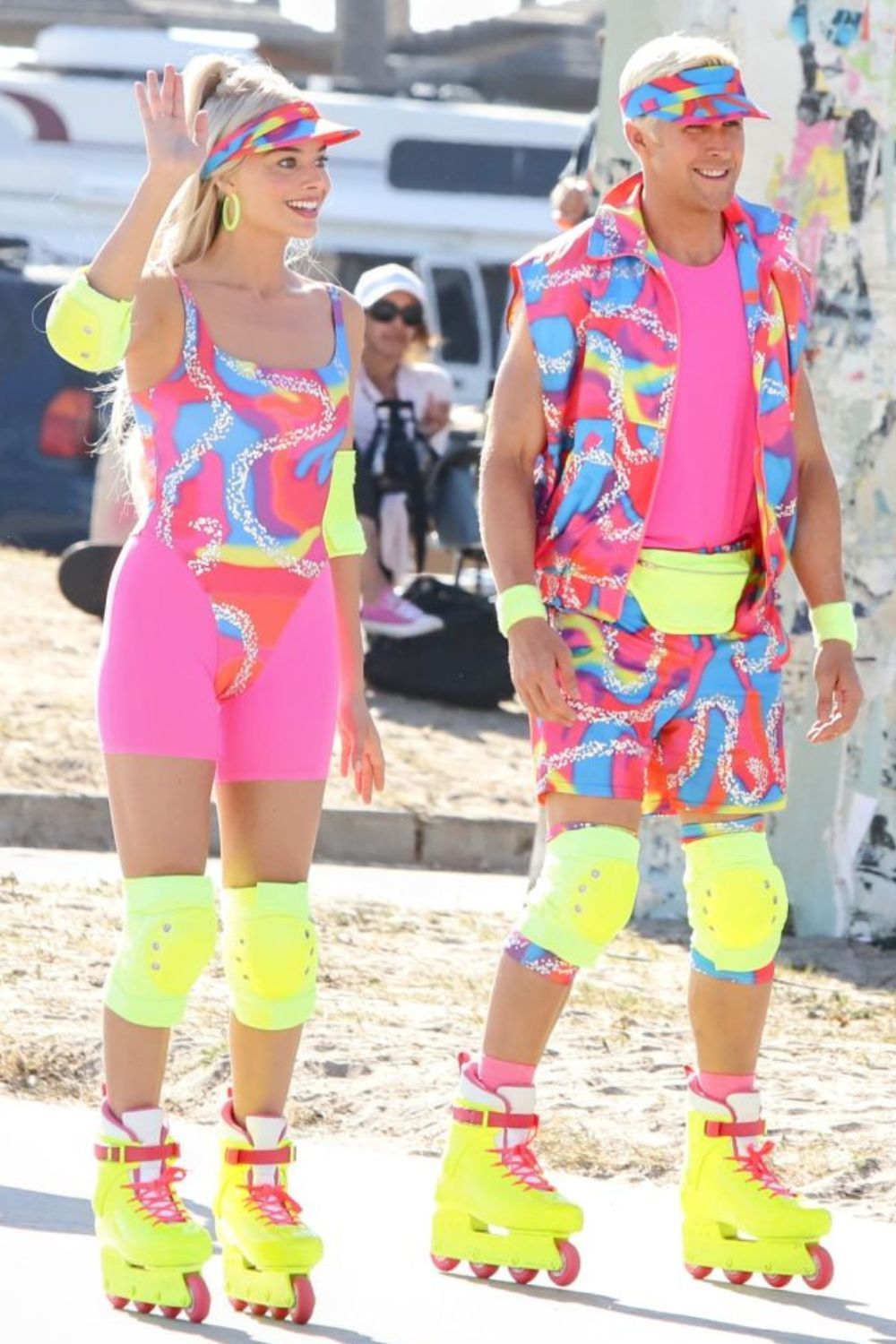 Margot Robbie and Ryan Gosling roller skating on the set of Barbie, learning how to roller skate