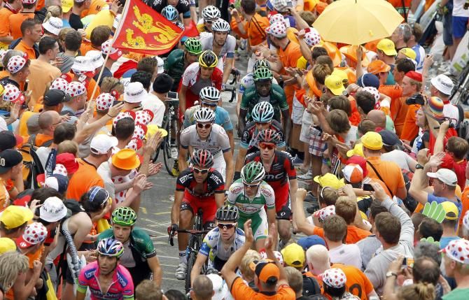 There is barely room for the riders to get through on the Alpe d'Huez, as they pass through Dutch corner