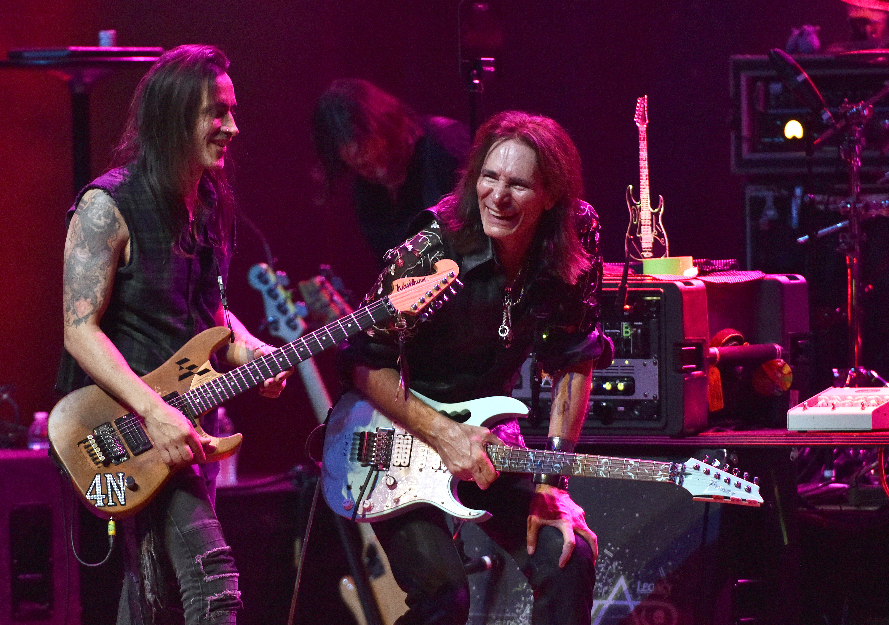Nuno Bettencourt (L) and Steve Vai perform during Generation Axe at the Fox Theater on November 7, 2018 in Oakland, California