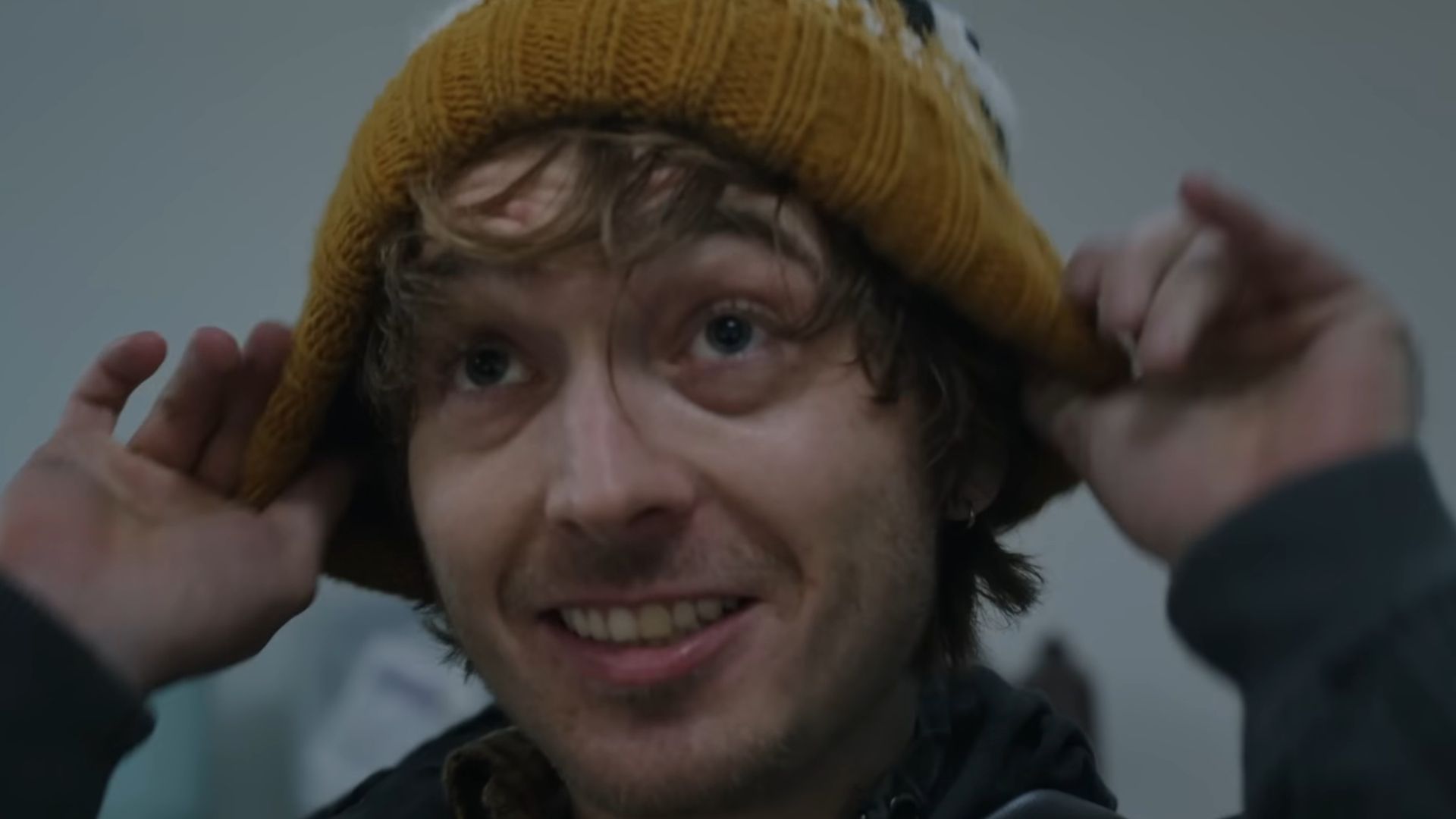 Bryan from Resident Evil putting on a hat