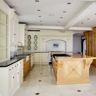 kitchen with wooden counter and white flooring