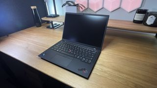 Lenovo Thinkpad X1 Carbon Gen 11 in a home office on a near-empty desk