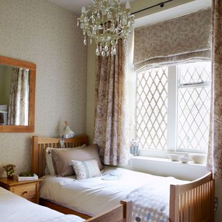 bedroom with curtains on window and wallpaper on wall