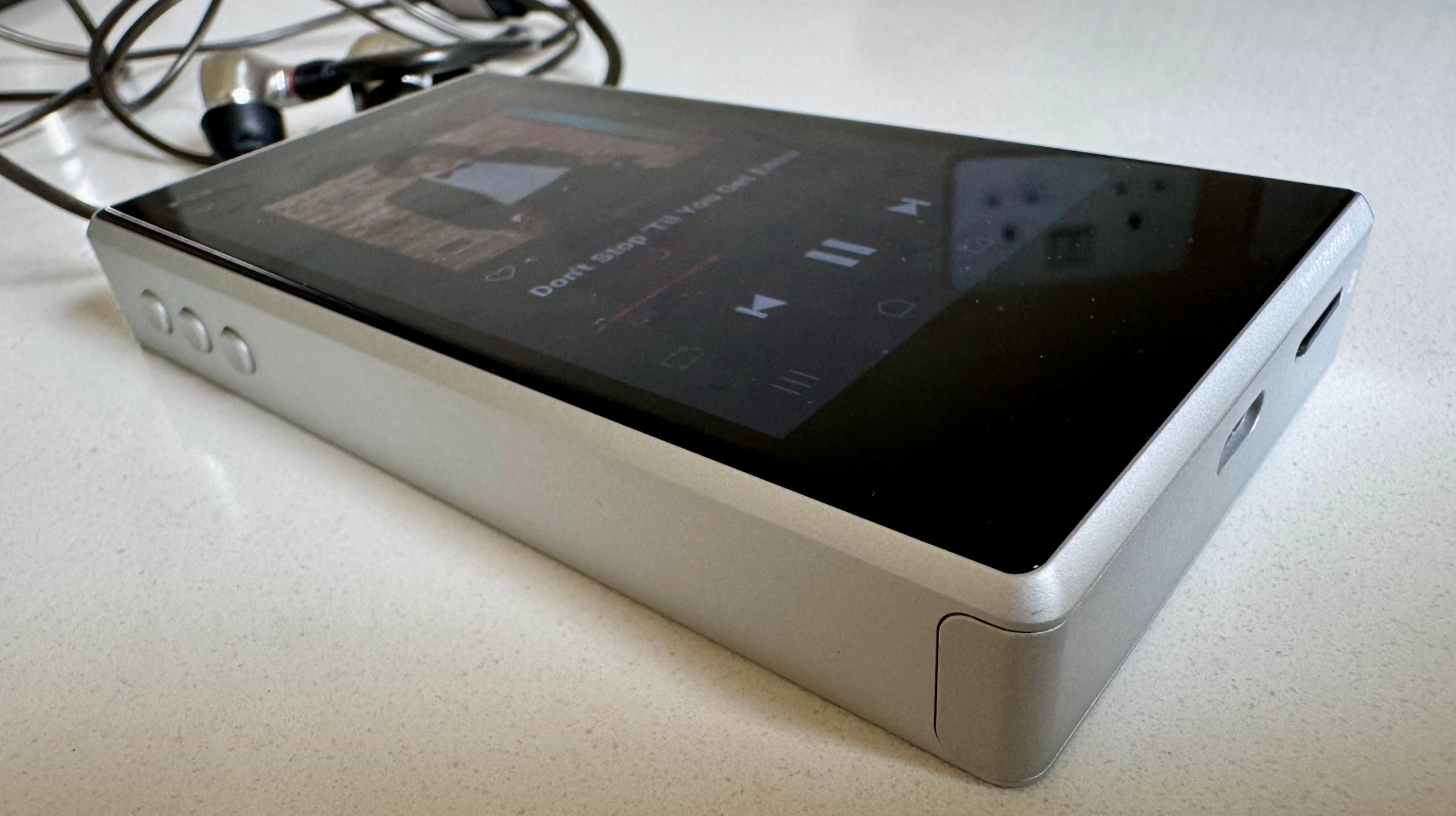 Astell &amp;amp; Kern's PD5 player on a gray table, showing details of the player
