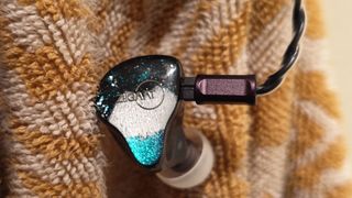 Various photos of the Ziigaat Horizon IEMs. 