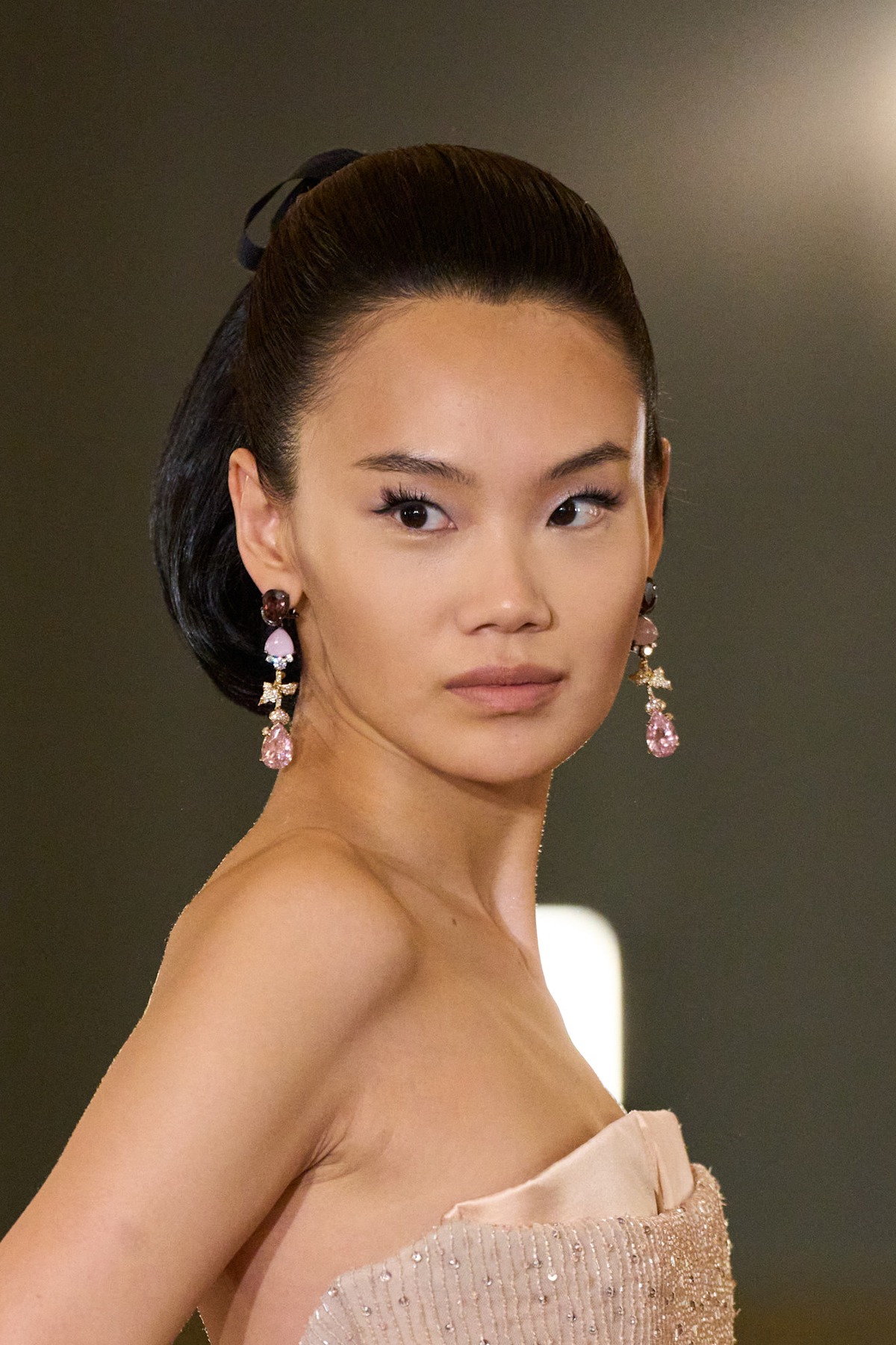 A model showing off a vintage-inspired wedding hairstyle.