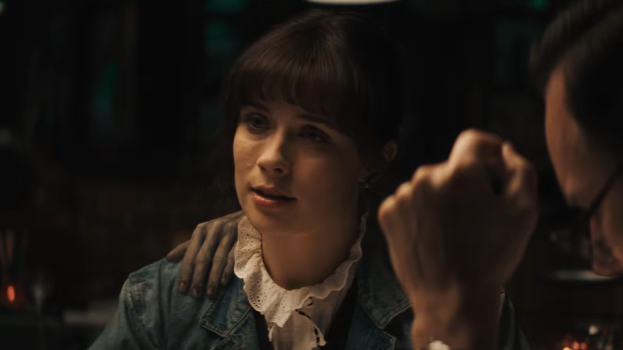 Mia Tomlinson as Judy Warren with a ghostly hand on her shoulder in The Conjuring: Last Rites