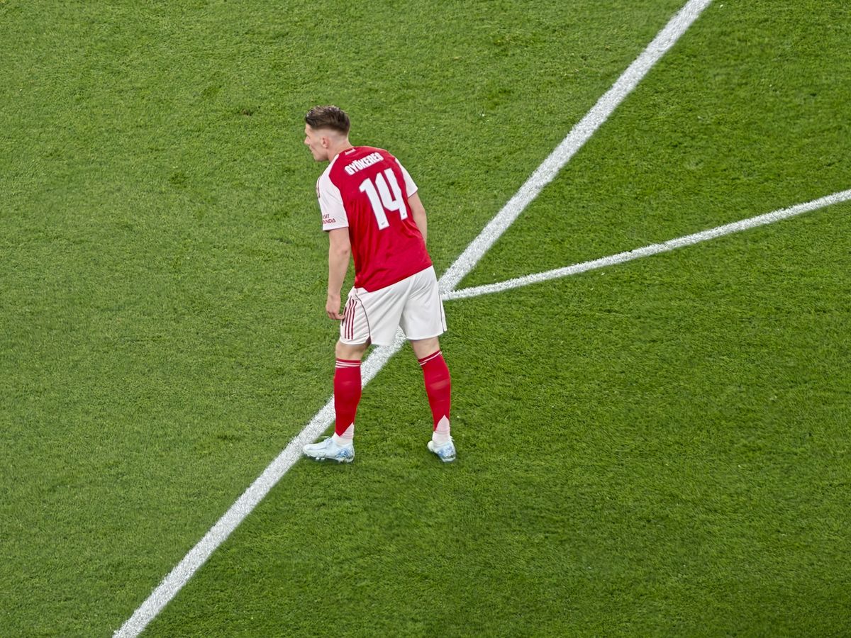 A Champions League soccer match between Arsenal and Atletico Madrid, as seen from the upper stand at the Emirates stadium, London. Zoomed in photos of the players
