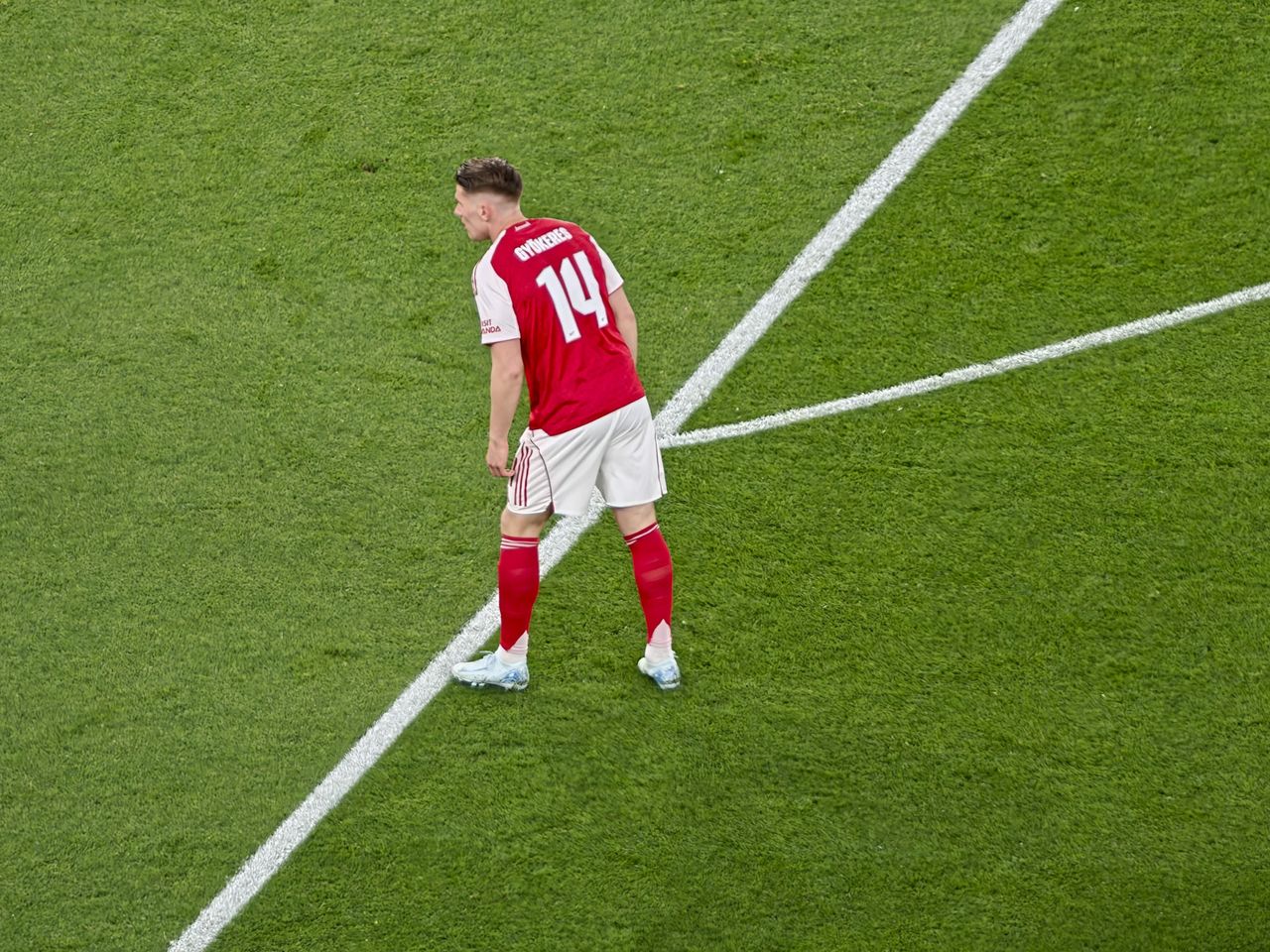 A Champions League soccer match between Arsenal and Atletico Madrid, as seen from the upper stand at the Emirates stadium, London. Zoomed in photos of the players