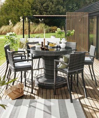 Camber Dining Bar Set with 6 Chairs from Furniture Village on deck