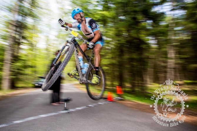 Dejay Birtch getting air over the road gap at the end of the stage.
