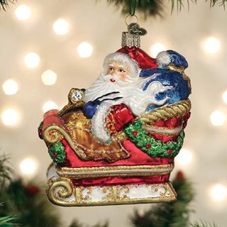 A santa in sleigh ornament