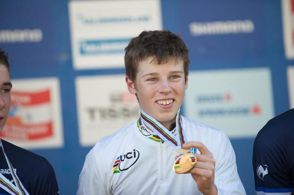 Anton Cooper (New Zealand) on the podium with his new jersey and gold medal