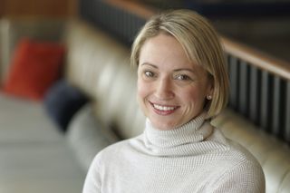 erin french from the tv show The lost kitchen smiling in a white sweater