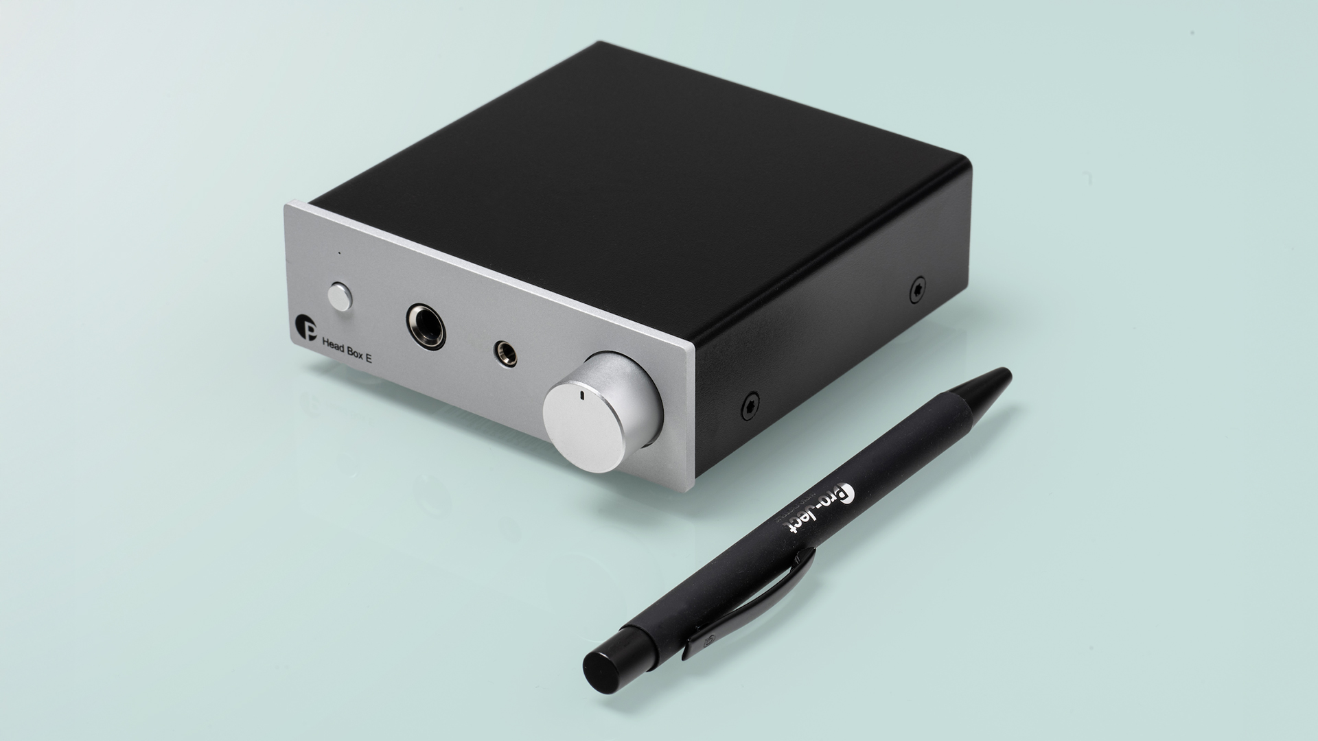 Pro-Ject Head Box E on a tabletop with a pen (to show its small size)