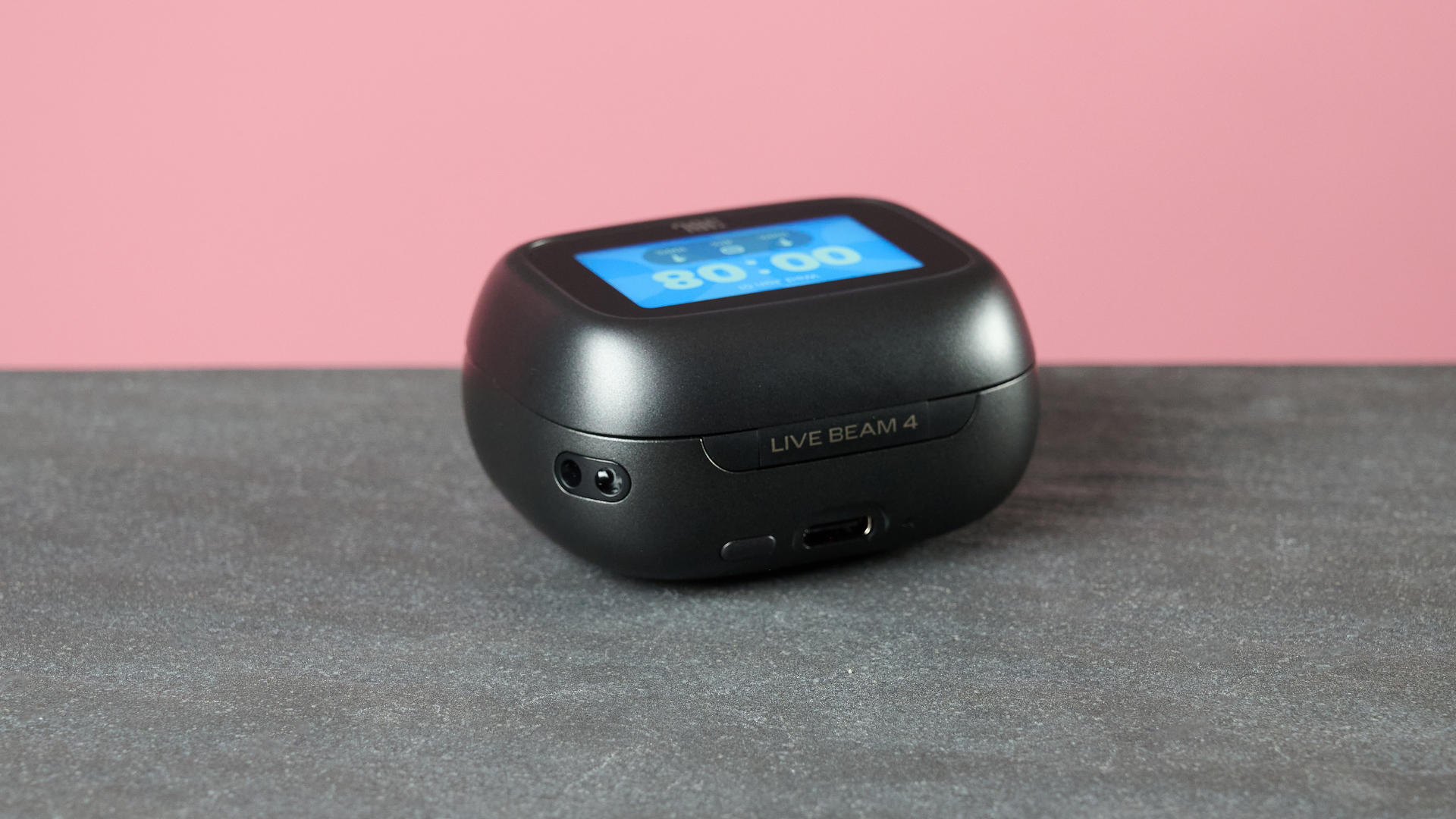 JBL Live Beam 4 smart charging case on table