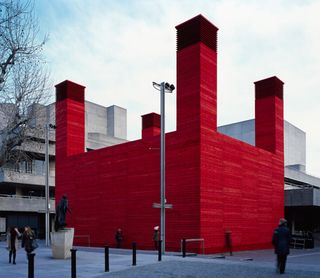 Exterior of The Shed theatre with bright red walls