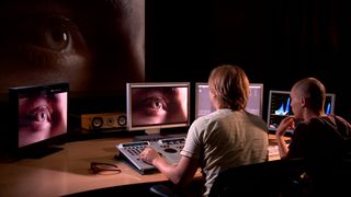 MetFilm School: two men sit at an editing desk and look at monitor screens