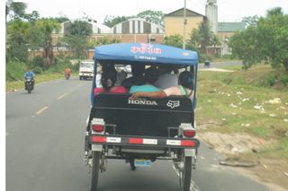 People often travel around on the back of three-wheeled motorbike taxis in Iquitos, Peru.