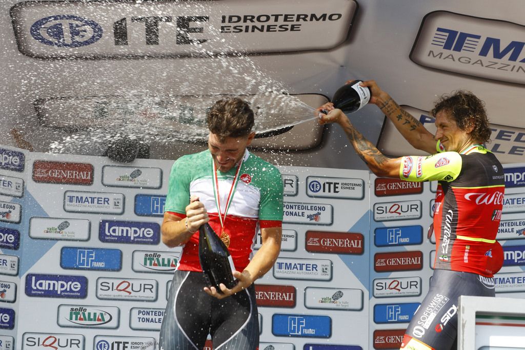 Filippo Pozzato (Wilier Triestina-Southeast) sprays Giacomo Nizzolo on the podium