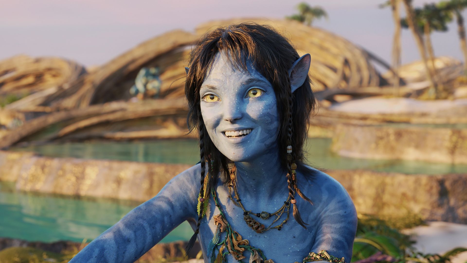 Kiri sits by the water